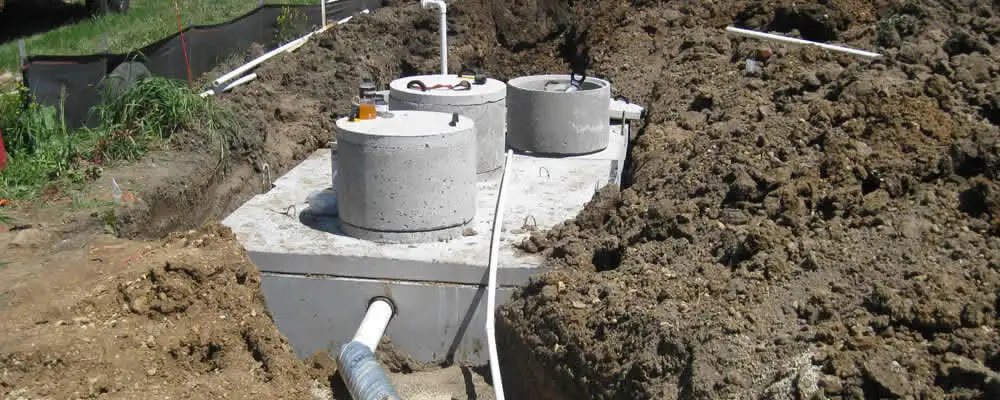 Septic system repair and installation site with tank access ports in Kissimmee, FL