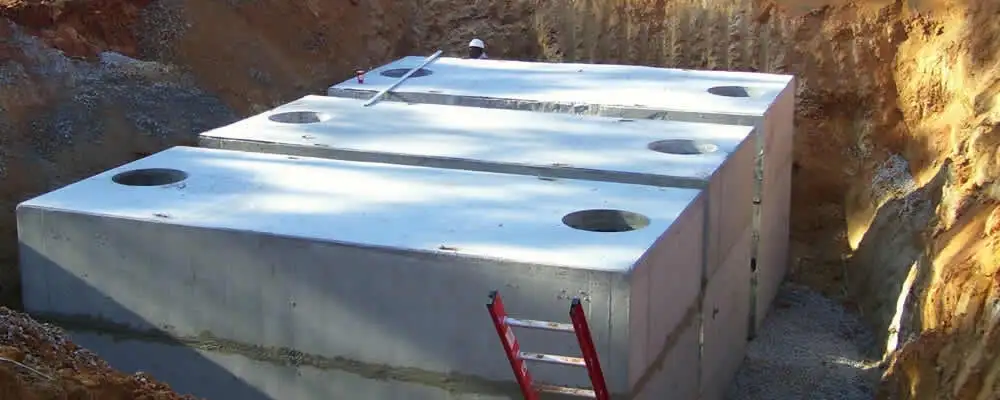 Septic tank installation site with a newly placed concrete tank in Kissimmee, FL